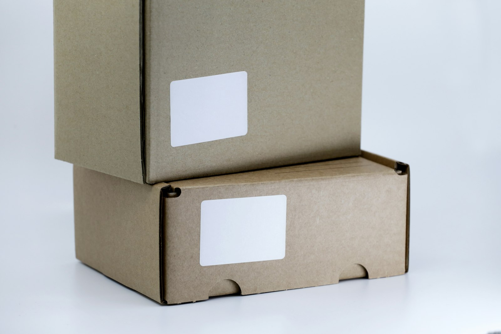 Single brown cardboard box sitting on a white table, ready for packing