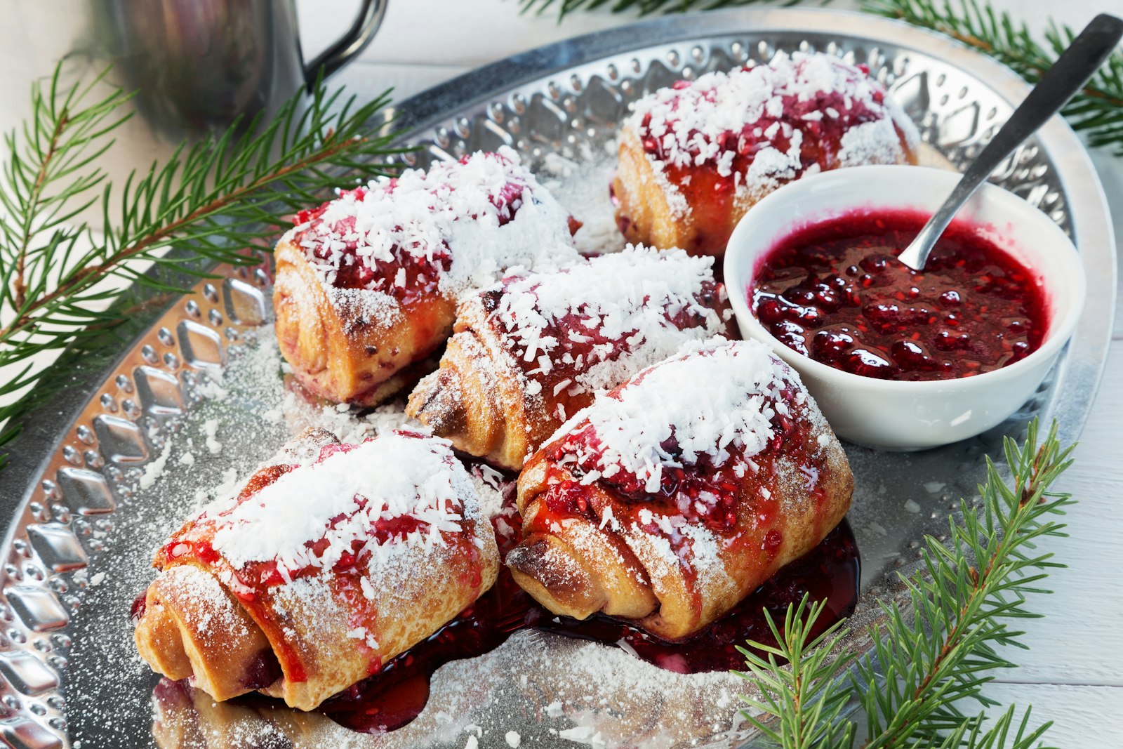 Plate of Christmas rolled cookies with jam, a festive treat to share with coworkers