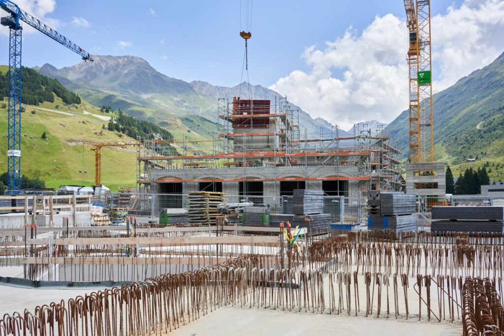 Construction site with cranes and a building under construction, showing modern building work