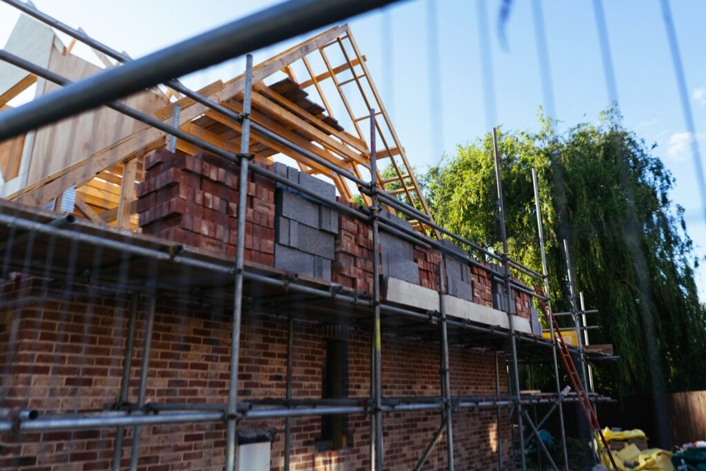 House under construction with scaffolding and bricks, illustrating the slowdown in UK housebuilding