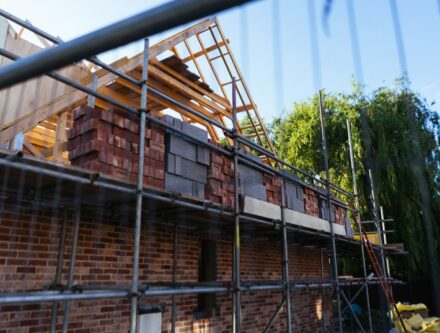 House under construction with scaffolding and bricks, illustrating the slowdown in UK housebuilding