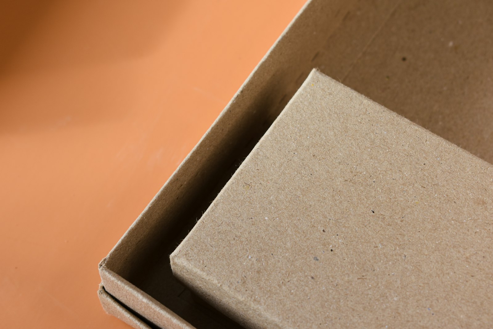 Open cardboard box on a table, representing sustainable packaging for businesses