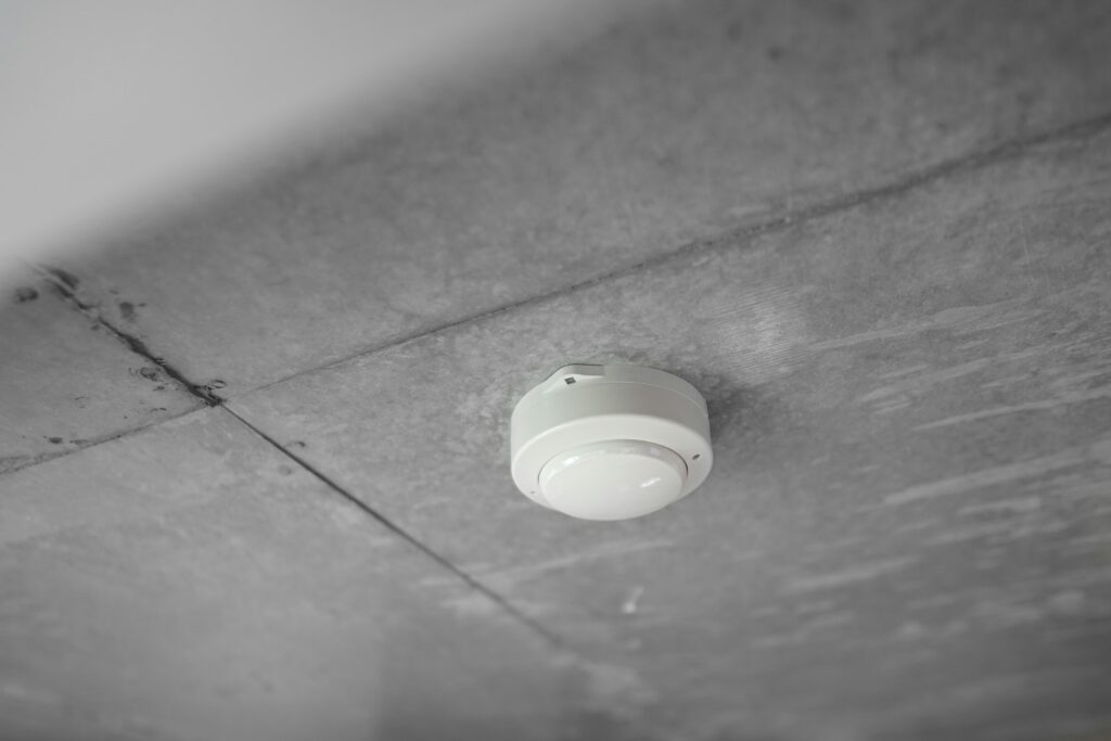 Fire alarm mounted on a ceiling, the kind of device that may need upgrading