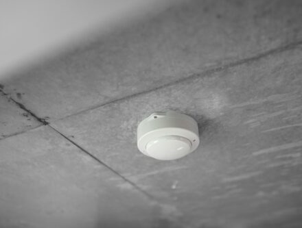 Fire alarm mounted on a ceiling, the kind of device that may need upgrading