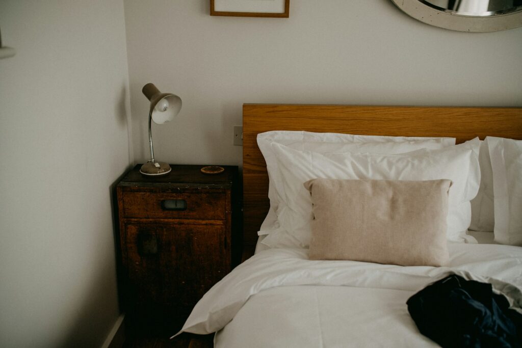 Cosy bedroom with a neatly made bed and a bedside table