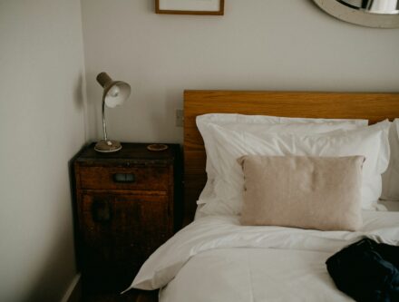 Cosy bedroom with a neatly made bed and a bedside table