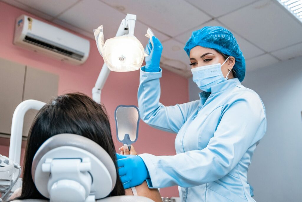 Woman having her teeth checked by a dentist during an appointment